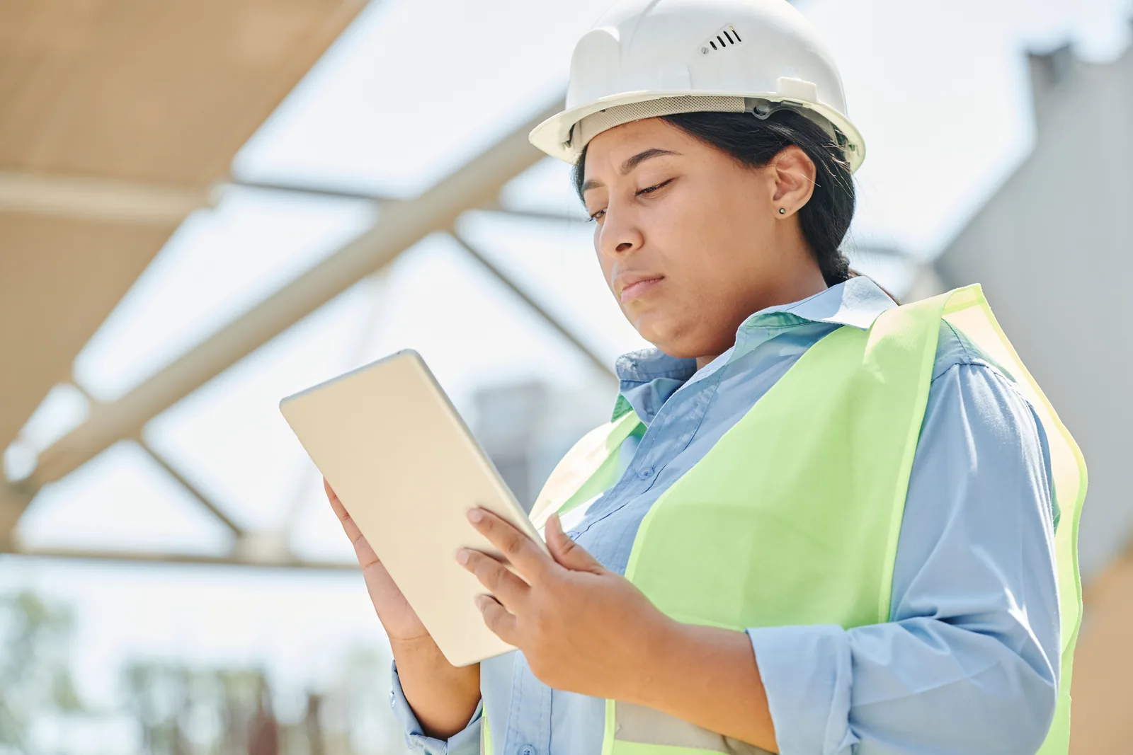 An engineer using a tablet during an on-site implementation.